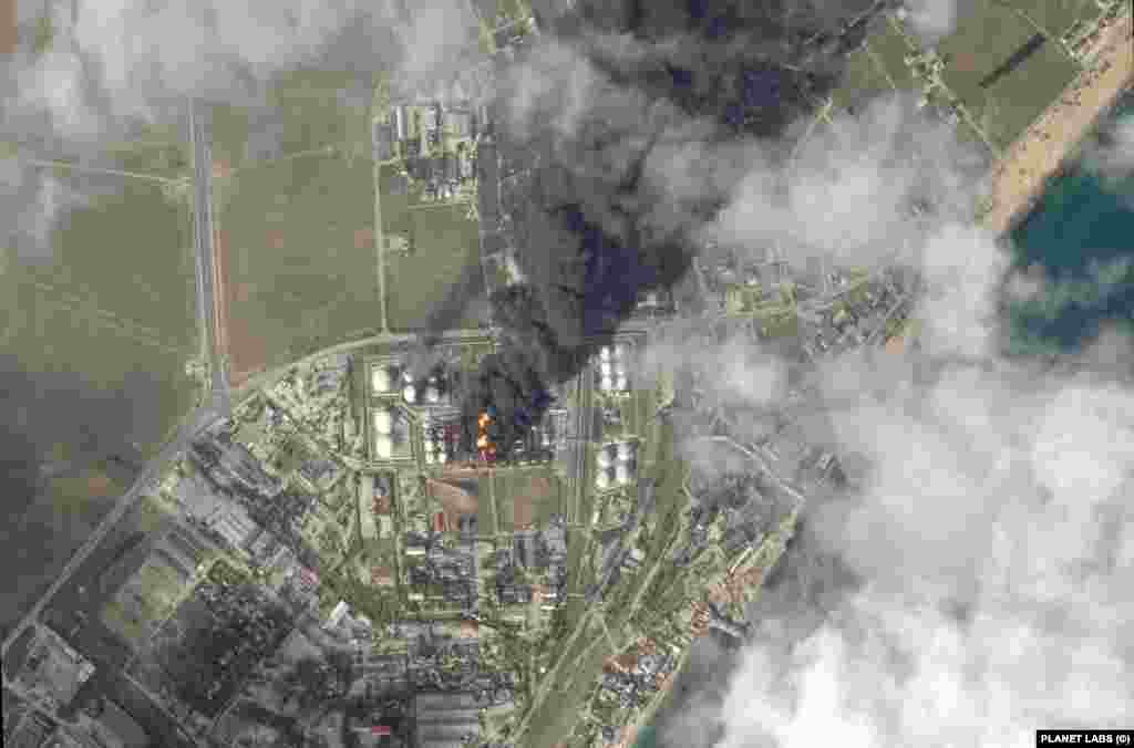  A satellite image shows fire and smoke rising from an oil depot in Feodosia, Crimea, Ukraine. &nbsp; 