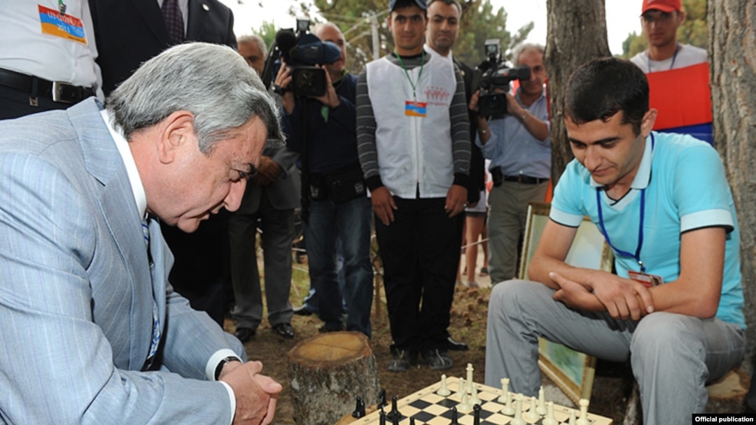 Armenian President Serzh Sarkisian plays chess during a visit to a youth camp in Lake Sevan in August.