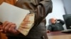 Russian Justice Ministry To Decriminalize 'Unavoidable' Bribes