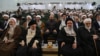 تصویری از مراسم تودیع و معارفه روسای جامعه‌المصطفی که با حضور رئيس دفتر خامنه‌ای (راست) برگزار شد