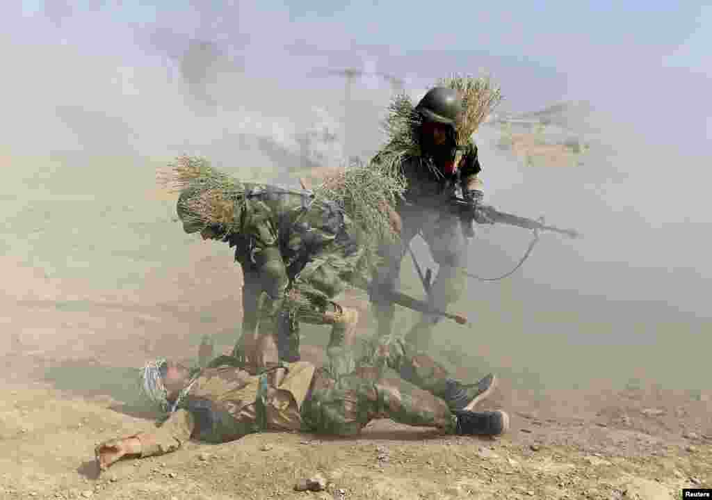 Afghan National Army (ANA) officers take part in a training exercise at the Kabul Military Training Center (KMTC) in Kabul on October 8. (Reuters/Omar Sobhani)