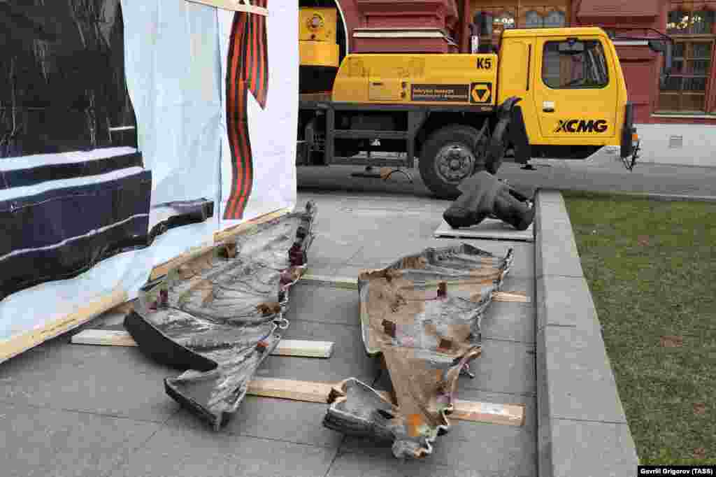 Pieces of the dismantled monument lie on the ground on March 20. The original monument cost a reported $3.2 million. It is not immediately clear how much was spent on the replacement copy. 