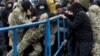 Migrants gather to receive food near the Belarusian-Polish border in the Grodno region