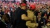 A man is restrained after he began shoving members of the media during a rally for President Donald Trump in El Paso, Texas, on February 11.