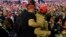 A man is restrained after he began shoving members of the media during a rally for President Donald Trump in El Paso, Texas, on February 11.