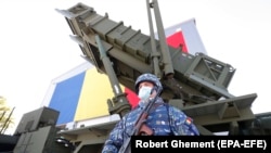 A Romanian soldier guards a Patriot missile system. (file photo)