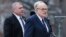 U.S. President Donald Trump's personal lawyer Rudy Giuliani (right) with Soviet-born businessman Lev Parnas at the funeral of President George Bush in Washington in 2018. 