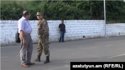 Armenia -- Colonel Artak Budaghian and his lawyer Hayk Alumian in Goris, 11Jul2013