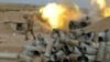 An Armenian soldier fires artillery during the military conflict over the breakaway region of Nagorno-Karabakh on October 4.