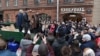 Pictured here standing on a truck in a knee-length, brown-leather jacket at the opening of one of his food stores, Russian businessman German Sterligov has sparked controversy by displaying homophobic signs on his premises. 