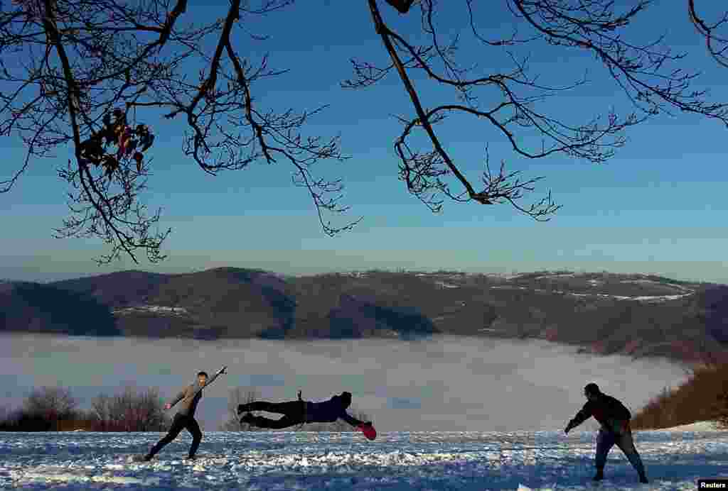 People play Frisbee on the Smetovi mountain range near Zenica, Bosnia-Herzegovina. (Reuters/Dado Ruvic)