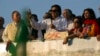 Imran Khan (C), Chairman of the Pakistan Tehreek-e Insaf (PTI) political party, addresses supporters in front of the parliament in Islamabad August 27, 2014.