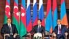 Russian President Dmitry Medvedev (center) sits down with his counterparts Serzh Sarkisian (right) of Armenia and Ilham Aliyev during talks over Nagorno-Karabakh.