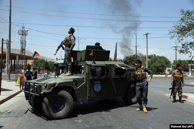 Afghan security forces arrive at the scene of the explosion in Kabul on July 1.