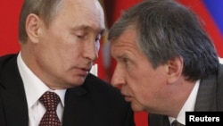 Rosneft President Igor Sechin (right) is a close ally of Russian President Vladimir Putin.