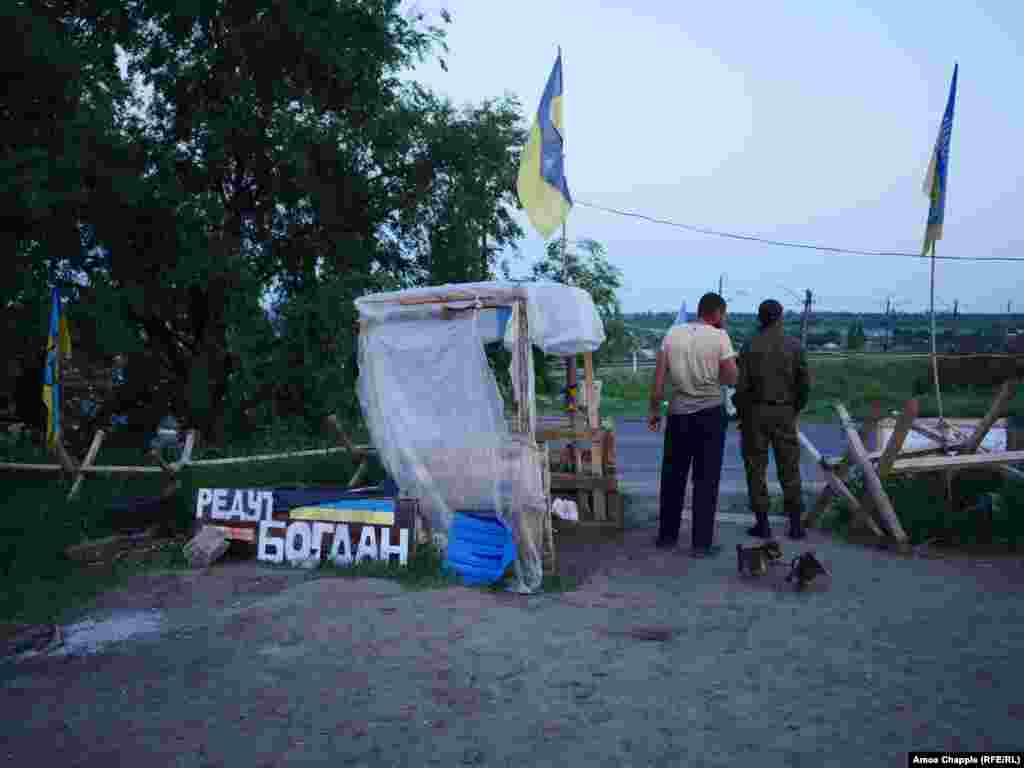 Puppies squeal and fight as night falls over the camp. A blockade leader told RFE/RL the activists want the more than 100 Ukrainians currently held prisoner in the separatist regions released before June 11 or their unspecified "action" will commence.