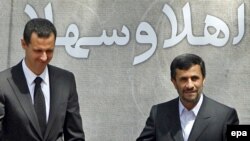 Iranian President Mahmud Ahmadinejad (right) greets his Syrian counterpart Bashar al-Assad in Tehran in August 2009.