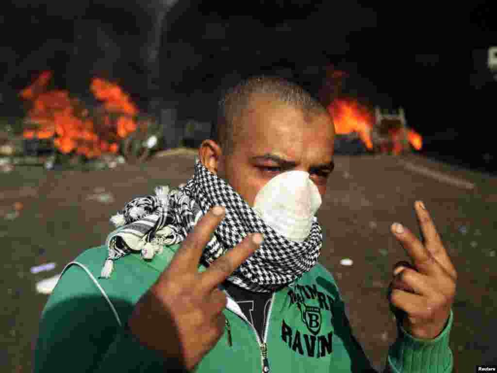 A protester gestures during protests in Cairo on January 28.