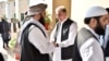 Pakistani Foreign Minister Shah Mehmood Qureshi (center) receives members of the Taliban delegation at the Foreign Office in Islamabad in October 2019. 