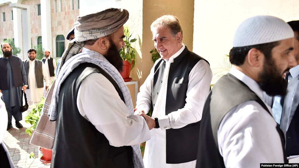 Pakistani Foreign Minister Shah Mehmood Qureshi (center) receives members of the Taliban delegation at the Foreign Office in Islamabad in October 2019.