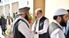 FILE: Pakistan's Foreign Minister Shah Mehmood Qureshi, center, receives members of Taliban delegation at the Foreign Office in Islamabad in October 2019.