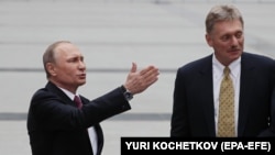 RUSSIA -- Russian President Vladimir Putin (Left) and Kremlin spokesman Dmitry Peskov (Right) meet with journalists after Putin's annual Question and Answer live-broadcast session.