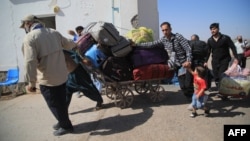 Afghan refugees deported from Iran return to their homeland. (file photo)