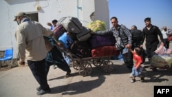 Afghan refugees deported by Iran return to their homeland. 