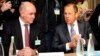 Switzerland -- Russian Foreign Minister Sergei Lavrov speaks to Vice Foreign Minister Grigory Karasin (L) before a meeting between representatives from Ukraine, the EU, and Russia in Geneva, April 17, 2014