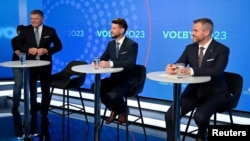 Party leaders Robert Fico (left to right); Michal Simecka, and Peter Pellegrini wait for a televised debate to begin at TV TA3 in Bratislava on September 26.