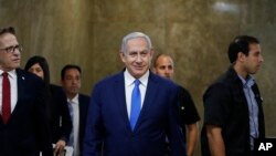 Israel's Prime Minister Benjamin Netanyahu arrives for the weekly cabinet meeting in Jerusalem, Sunday, July 14, 2019. (Ronen Zvulun/Pool Photo via AP)