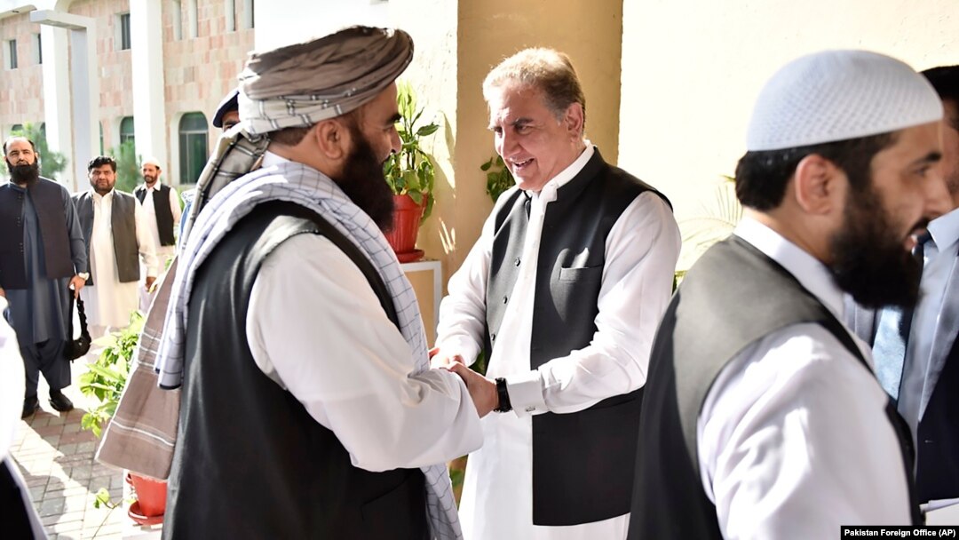 Pakistani Foreign Minister Shah Mehmood Qureshi (center) receives members of the Taliban delegation at the Foreign Office in Islamabad in October 2019. 