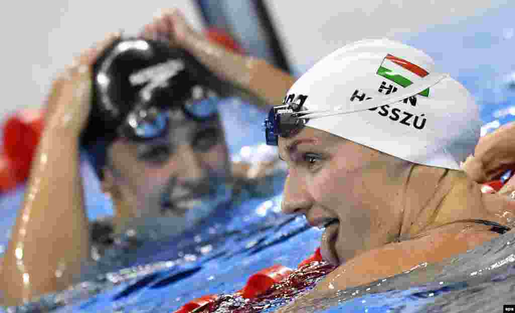 Katinka Hosszu of Hungary celebrates after winning the women's 100-meter backstroke to claim her second gold medal of the Rio Olympics.