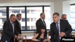 The Armenian National Congress (HAK) agreed to new talks after assurances that Davit Harutiunian, a senior pro-government parliamentarian seen at right in the July 18 meeting, represents President Serzh Sarkisian.