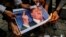 Iranians burn an image of U.S. President Donald Trump during a demonstration outside the former U.S. Embassy in Tehran on May 9.
