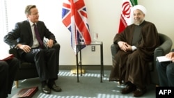 British Prime Minister David Cameron (left) meets with Iranian President Hassan Rohani at UN headquarters in New York on September 24. 