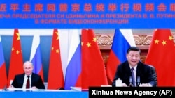 Рускиот претседател Владимир Путин и кинескиот претседател Си Џинпинг, на видео состанок, јули 2021.