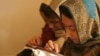 Afghan women sew clothes at a design shop in Kabul. (file photo)