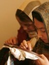 Afghan women sew clothes at a design shop in Kabul. (file photo)