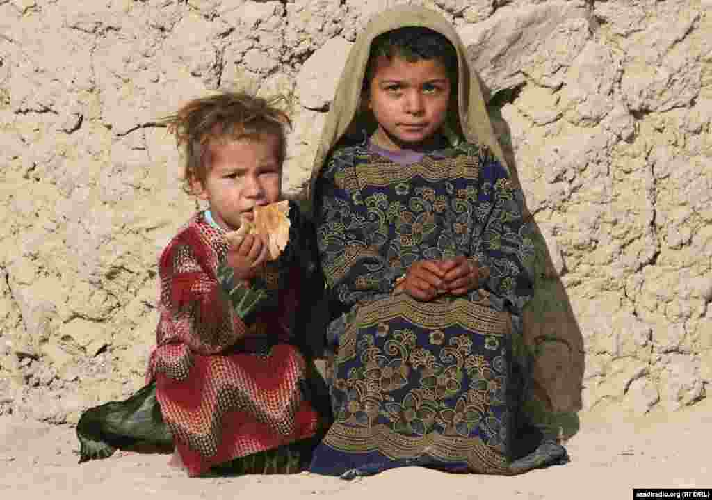 Two children at a UN camp for displaced persons. Photo by RFE/RL's Radio Free Afghanistan