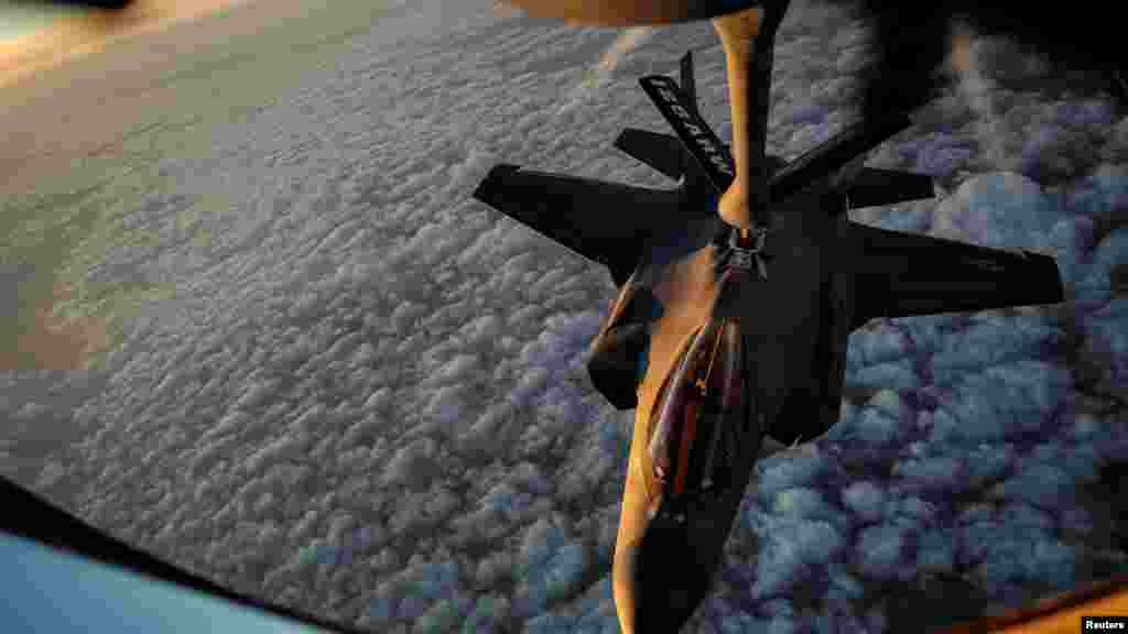 A US Air Force KC-135 Stratotanker aircraft refuels a F-35A Lightning II aircraft at an undisclosed location on April 5.