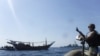 ARABIAN GULF - The Arleigh Burke-class guided-missile destroyer USS McFaul's visit, board, search and seizure team pulls alongside a Bahraini dhow during routine maritime security operations in the Arabian Gulf, June 25, 2019
