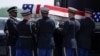 Members of the US military transfer the remains of four US Army service members recently killed in the Iran war, in Dover, Delaware, on July 22.