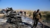 Iraqi security forces inspect the site of a deadly bomb attack in Tikrit on November 6. 