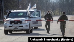 Vehicles of the OSCE Special Monitoring Mission to Ukraine in the Donetsk region in April 2020