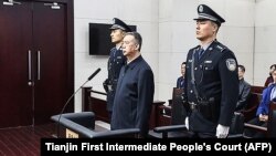 Fostul șef al Interpolului, Meng Hongwei, la procesul lui din Tianjin, în China, în ianuarie 2020, când a fost condamnat la 13 ani închisoare după ce a fost "răpit" de autoritățile chineze.