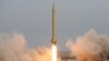 Iran's Revolutionary Guards fire a Shahab-3 missile during war games in the desert near the holy city of Qom, southeast of Tehran, in November 2006.