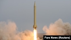 Iran's Revolutionary Guards fire a Shahab-3 missile during war games in the desert near the holy city of Qom, southeast of Tehran, in November 2006.