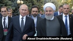 Russian President Vladimir Putin and Iranian President Hassan Rouhani arrive for a meeting on the sidelines of a session of the Supreme Eurasian Economic Council In Yerevan, Armenia October 1, 2019.