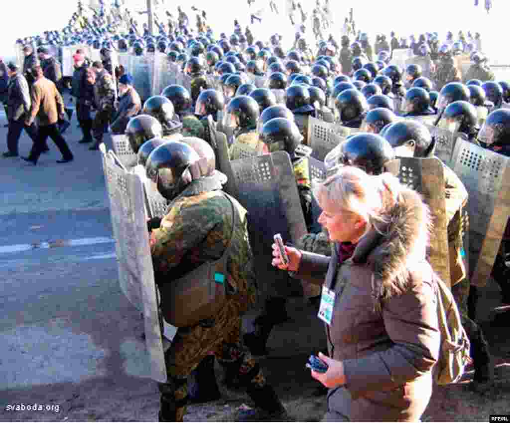 Maksim Kapran, a correspondent from RFE/RL's service to Belarus, covers a protest as riot police march to shut it down.